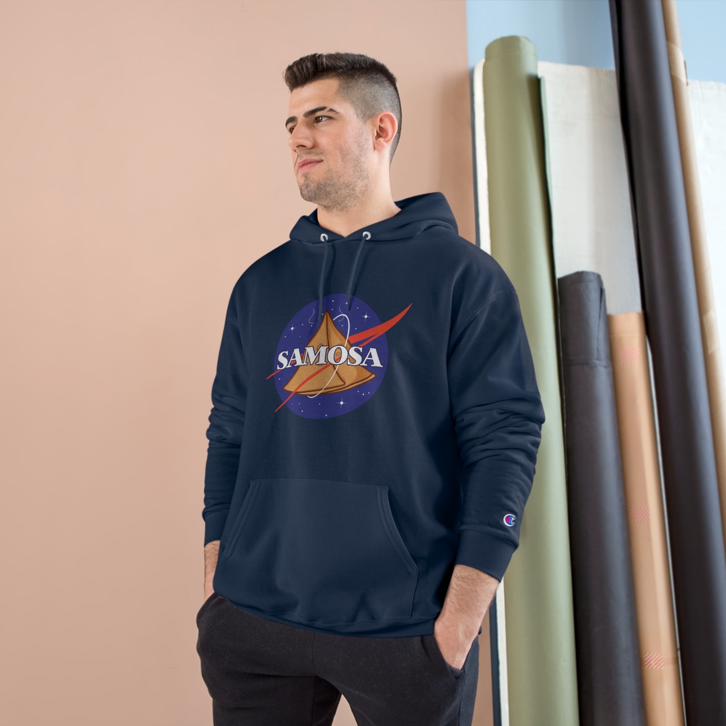 Man wearing NASA Samosa Champion hoodie in navy, showcasing quirky design with spacious pocket and cozy fit.
