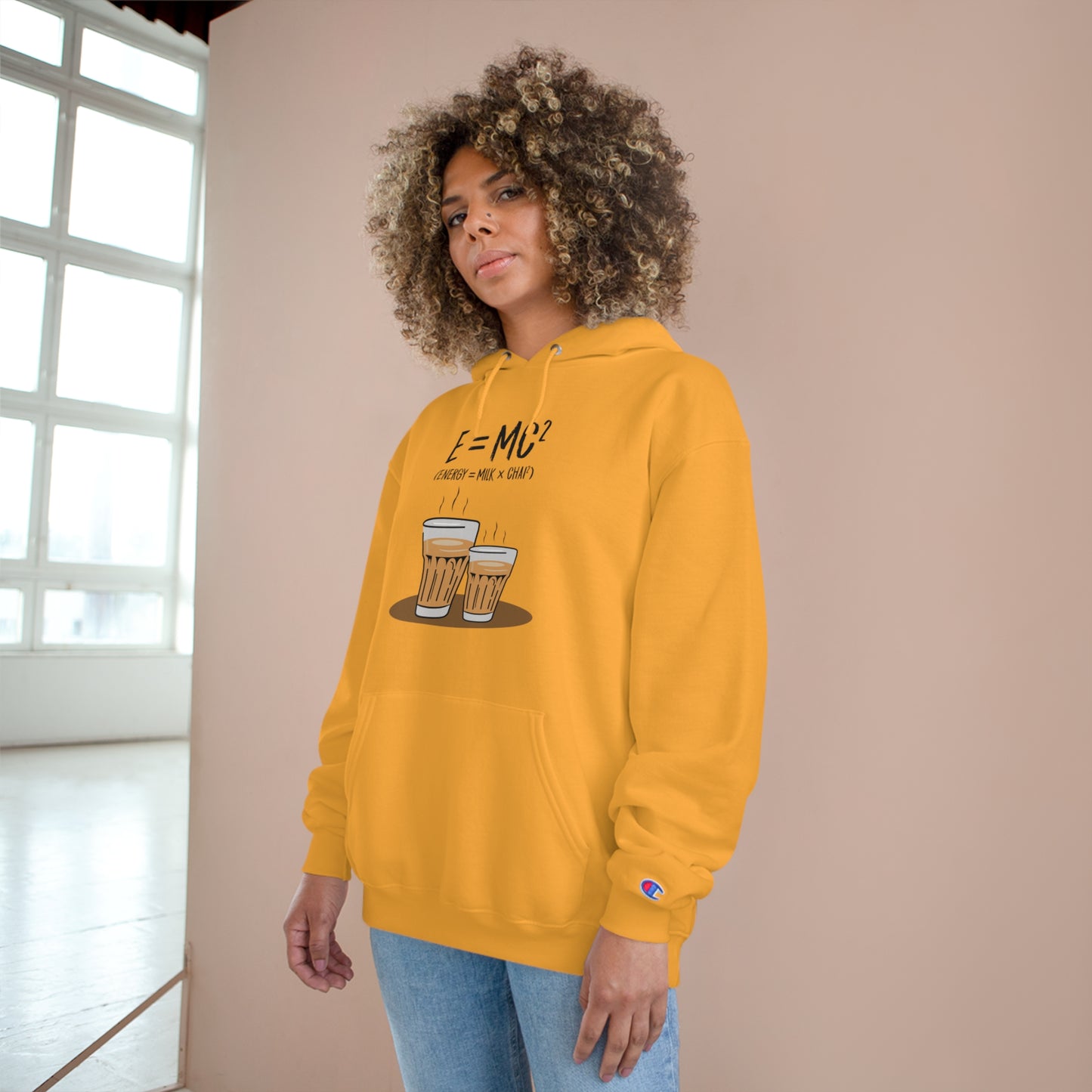 E=M*C Champion hoodie in vibrant yellow, featuring chai graphic, cozy design, and spacious front pocket. Perfect for chai lovers.