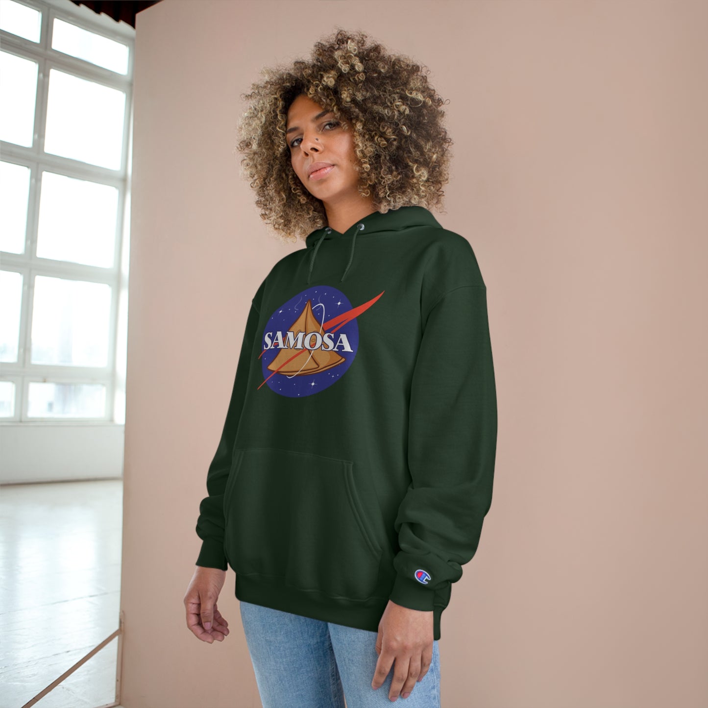 Woman wearing a NASA Samosa Champion hoodie with a quirky space-inspired graphic, perfect for snack lovers.