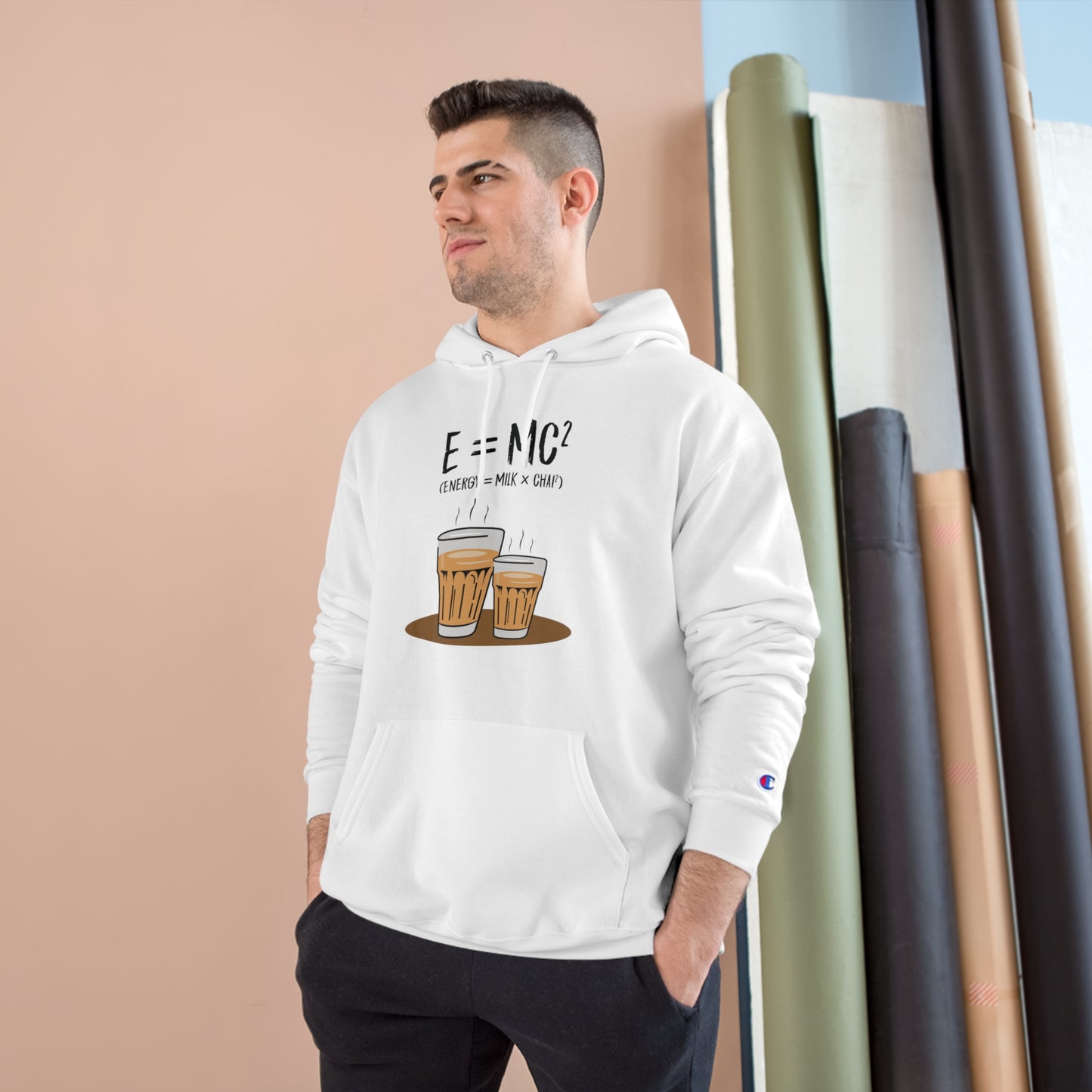 Man wearing E=M*C Champion hoodie with chai graphic, showcasing cozy style and comfort. Ideal for chai lovers.