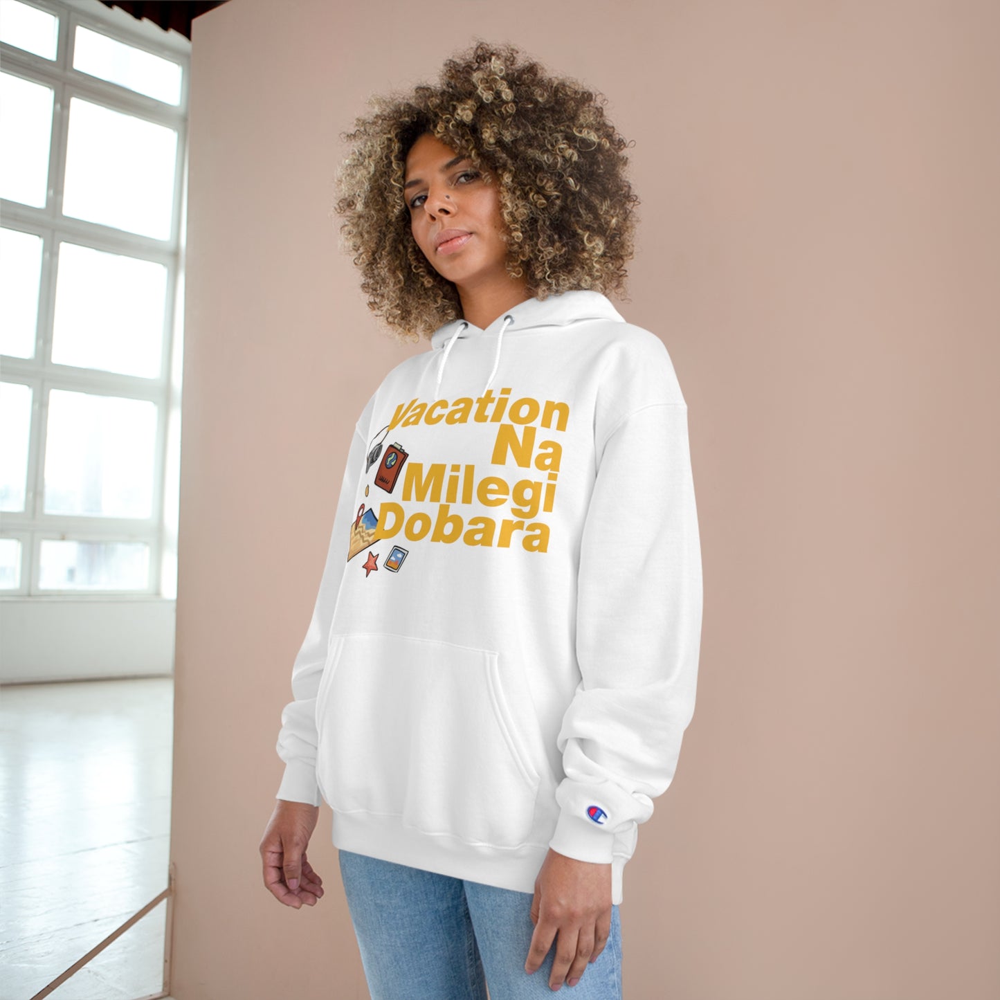 White VNMD Champion hoodie with "Vacation Na Milegi Dobara" graphic, model showcasing stylish travel apparel.